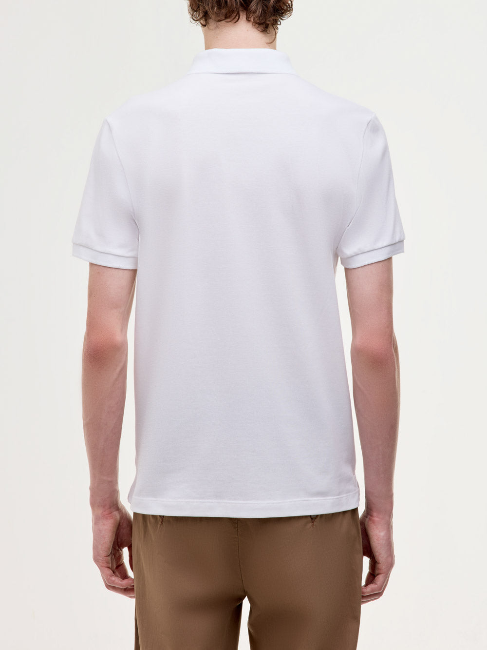 Polo in piquet stretch con logo ricamato