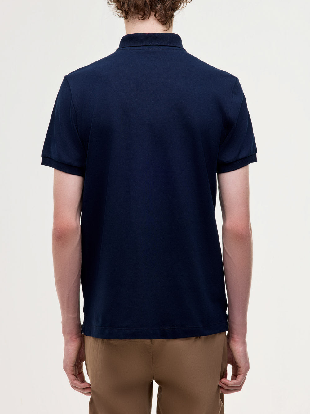Polo in piquet stretch con logo ricamato
