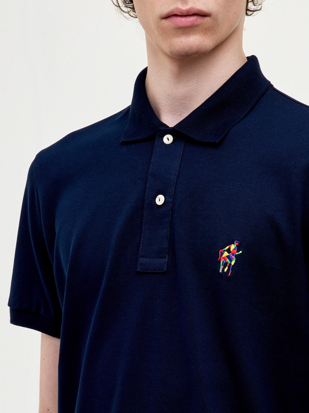 Polo in piquet stretch con logo ricamato